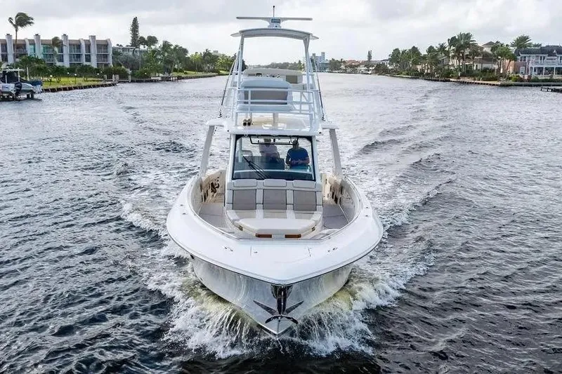 Slide: The Image of 2022 Boston Whaler 420 Outrage cruising on a scenic waterway. - 3