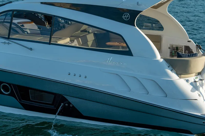 Slide: The Image of Luxury Hanover 375 yacht cruising on water, 2026 model, sleek design and modern interior. - 100