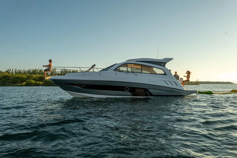 Slide: The Image of 2026 Hanover 375 yacht on water with people enjoying the sunset. - 109
