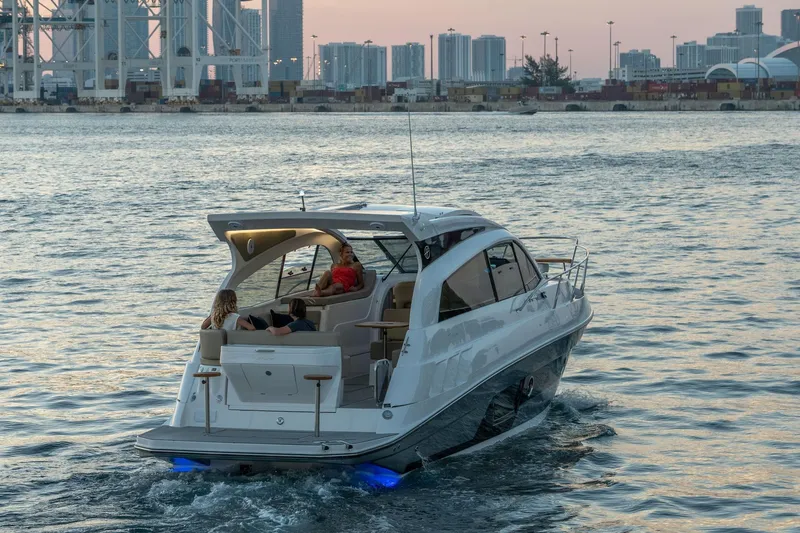 Slide: The Image of Luxury Hanover 375 yacht cruising near city skyline at sunset, 2026 model. - 114