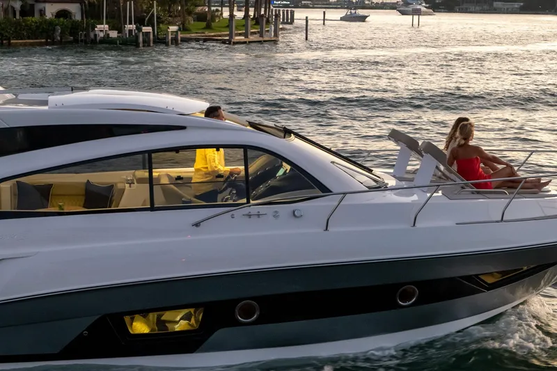 Slide: The Image of 2026 Hanover 375 yacht cruising with passengers enjoying the sunset on deck. - 119