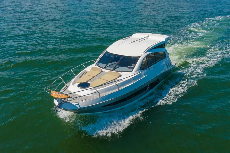 Slide: The Image of 2026 Hanover 375 yacht cruising on open water, showcasing sleek design and luxury features. - 27