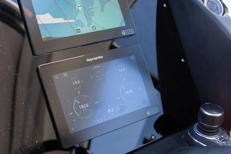 Slide: The Image of Digital navigation and control screens on a 2026 Hanover 375 boat dashboard. - 49
