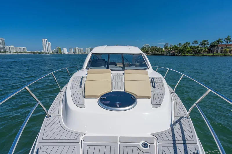 Slide: The Image of Luxury Hanover 375 yacht cruising on a sunny day, city skyline in background, 2026 model. - 66