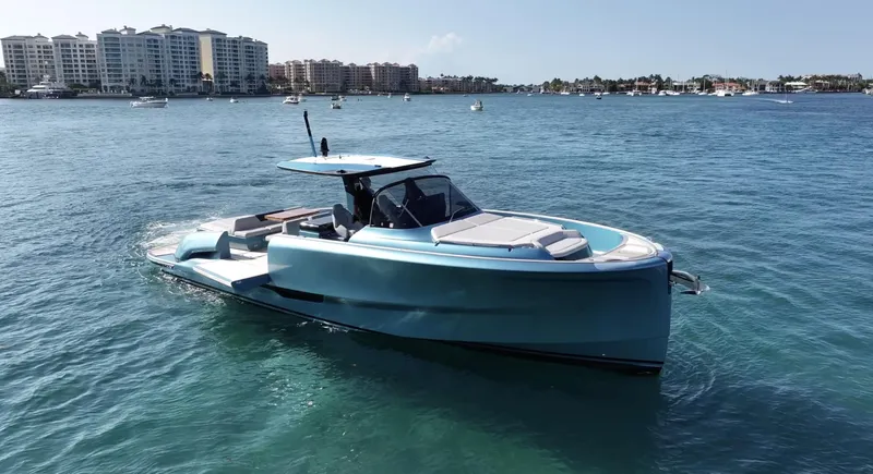 Slide: The Image of 2022 Solaris Power 44 yacht on calm water with cityscape background. - 0