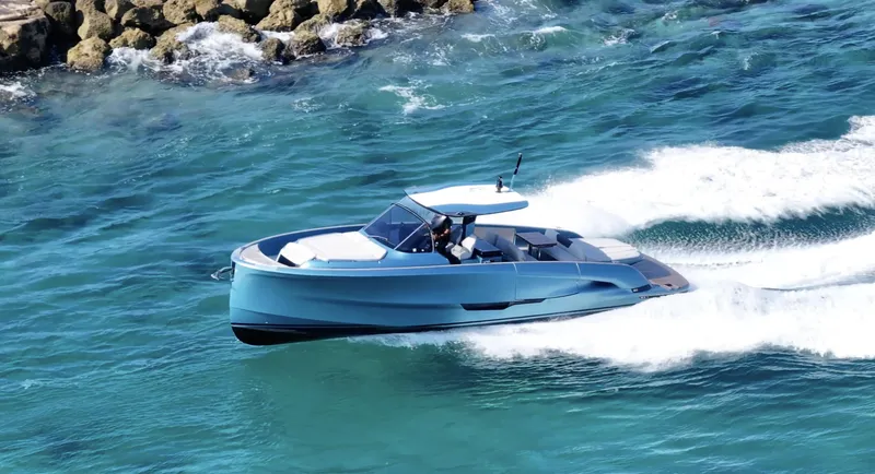 Slide: The Image of 2022 Solaris Power 44 yacht cruising in clear blue waters. - 1