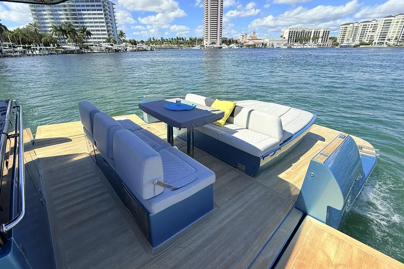 Slide: The Image of Luxurious 2022 Solaris Power 44 yacht with elegant seating, cruising on a sunny waterfront. - 17