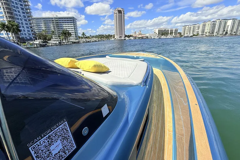 Slide: The Image of 2022 Solaris Power 44 yacht on water, city skyline, sunny day, QR code visible. - 23