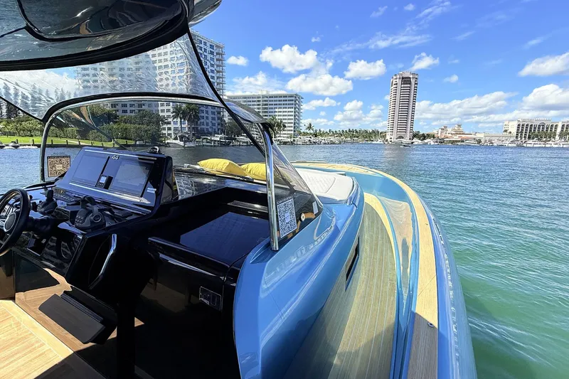 Slide: The Image of 2022 Solaris Power 44 yacht with sleek design, docked in a scenic waterfront location. - 24