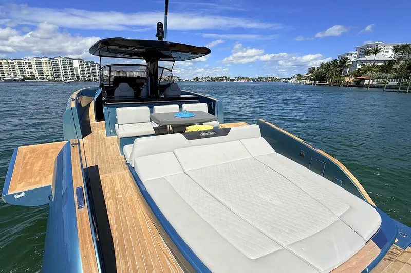 Slide: The Image of Luxurious 2022 Solaris Power 44 yacht with spacious deck, cruising on scenic waterfront. - 25