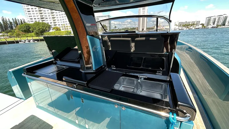 Slide: The Image of Luxury 2022 Solaris Power 44 yacht with sleek outdoor kitchen and stunning waterfront view. - 29