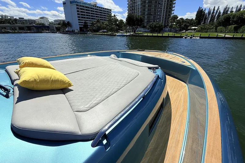 Slide: The Image of Luxurious 2022 Solaris Power 44 yacht with sunbed and yellow cushions on deck. - 33