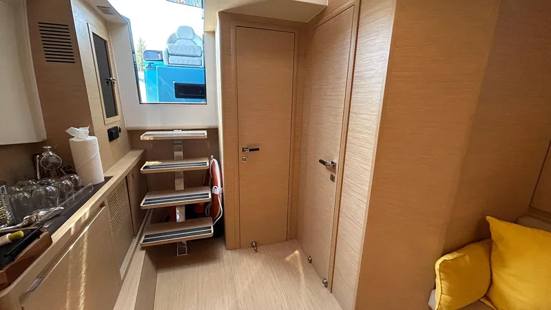 Slide: The Image of Interior of 2022 Solaris Power 44 yacht with modern wood finish and compact design. - 38