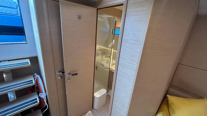 Slide: The Image of Interior of 2022 Solaris Power 44 yacht, featuring a modern bathroom and cozy cabin. - 40