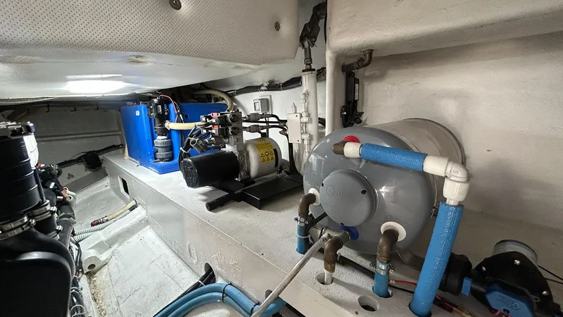 Slide: The Image of Engine room of 2022 Solaris Power 44 yacht with mechanical equipment and piping. - 47