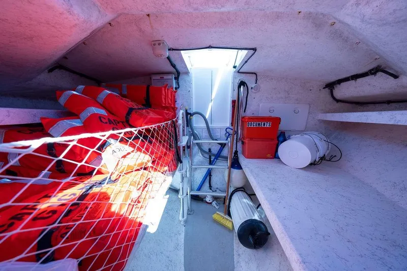 Slide: The Image of Interior of 2018 Seahawk Island Hopper boat with life jackets and safety equipment. - 10