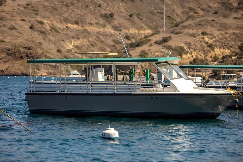 Slide: The Image of 2018 Seahawk Island Hopper boat docked in scenic coastal waters. - 3