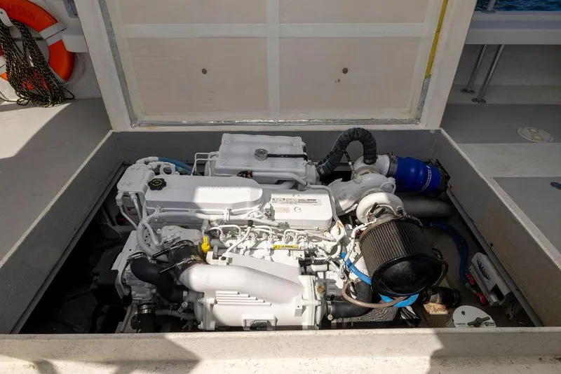 Slide: The Image of Engine compartment of a 2018 Seahawk Island Hopper boat, showcasing detailed machinery. - 6