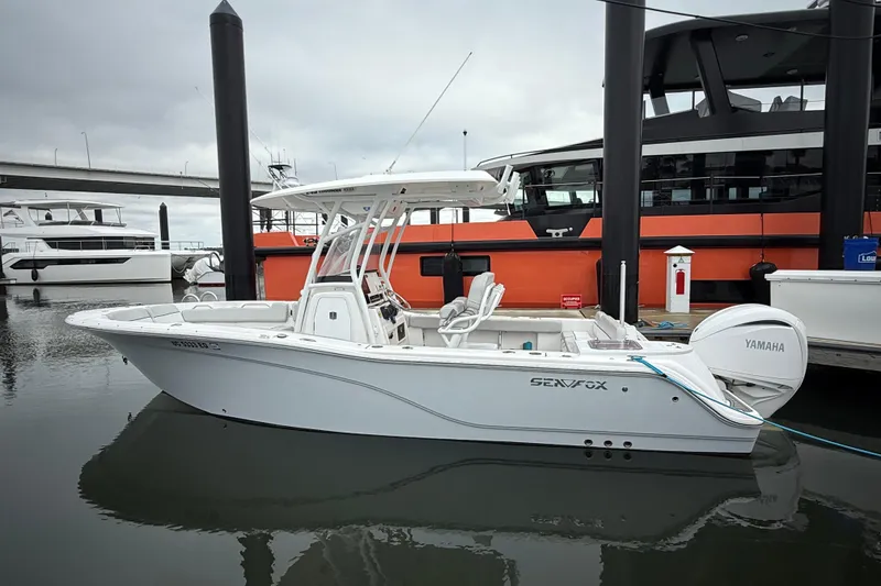 The Image of 2023 Sea Fox 248 Commander boat docked, featuring Yamaha engine, sleek design, and modern amenities. - 0