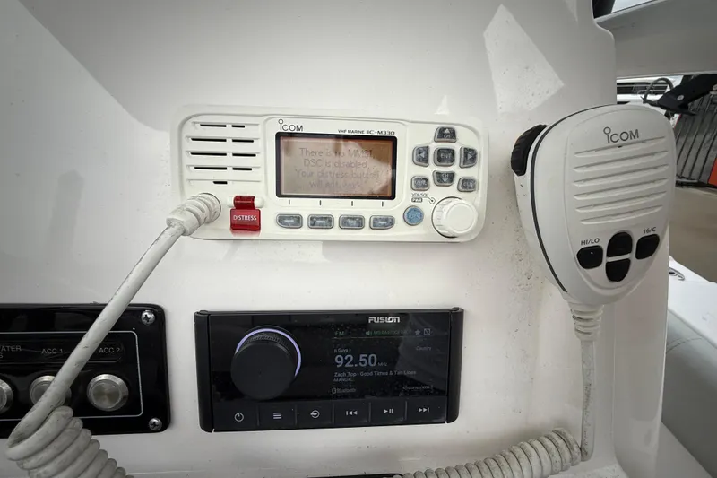 Slide: The Image of ICOM VHF radio and Fusion stereo on 2023 Sea Fox 248 Commander boat console. - 10