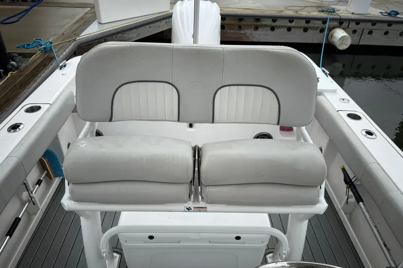 Slide: The Image of 2023 Sea Fox 248 Commander boat seating with wet cushions at dockside. - 12