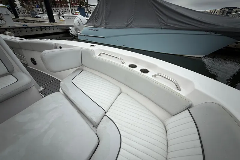 Slide: The Image of 2023 Sea Fox 248 Commander boat interior with cushioned seating and cup holders. - 16