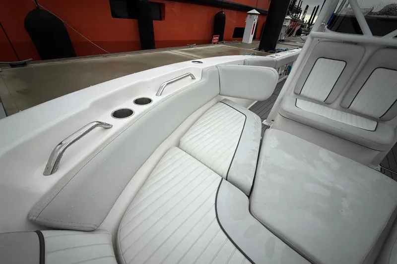 Slide: The Image of 2023 Sea Fox 248 Commander boat interior with cushioned seating and cup holders. - 17