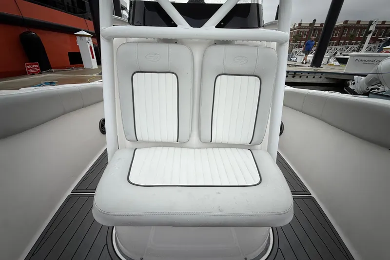 Slide: The Image of 2023 Sea Fox 248 Commander boat seat with white upholstery and black trim. - 18