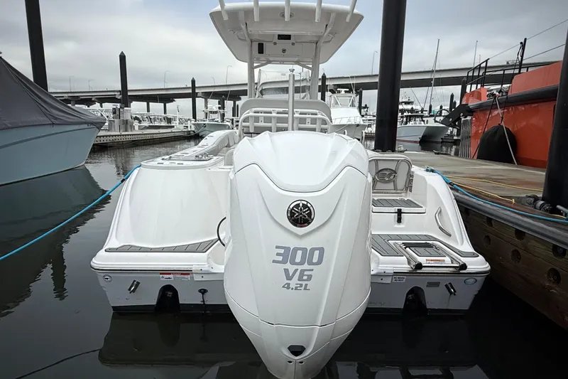 Slide: The Image of 2023 Sea Fox 248 Commander boat docked, featuring a powerful 300 V6 engine. - 2