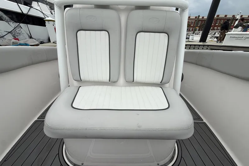 Slide: The Image of 2023 Sea Fox 248 Commander boat seating with white and gray upholstery. - 25
