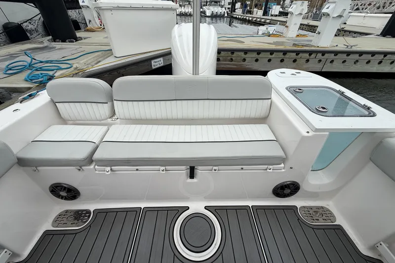 Slide: The Image of 2023 Sea Fox 248 Commander boat interior with seating and deck view. - 26