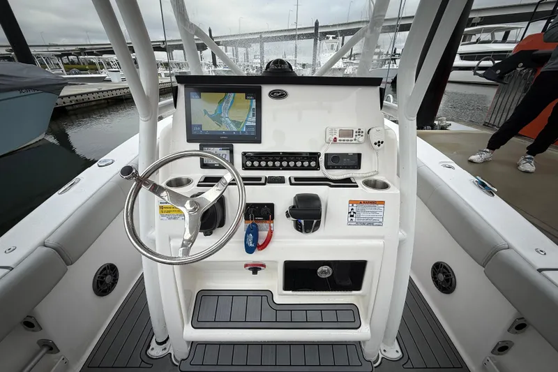 Slide: The Image of 2023 Sea Fox 248 Commander boat dashboard with steering wheel and navigation system. - 7