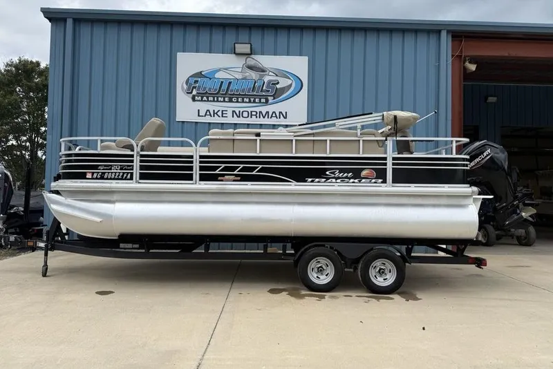 The Image of 2023 Sun Tracker SportFish 20 DLX pontoon boat on trailer at Foothills Marine Center. - 1