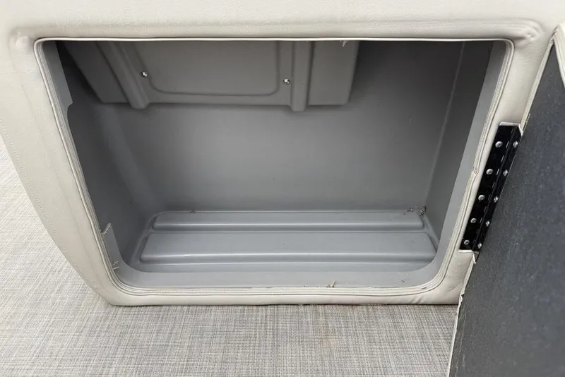 Slide: The Image of 2023 Sun Tracker SportFish 20 DLX storage compartment, open and empty. - 10