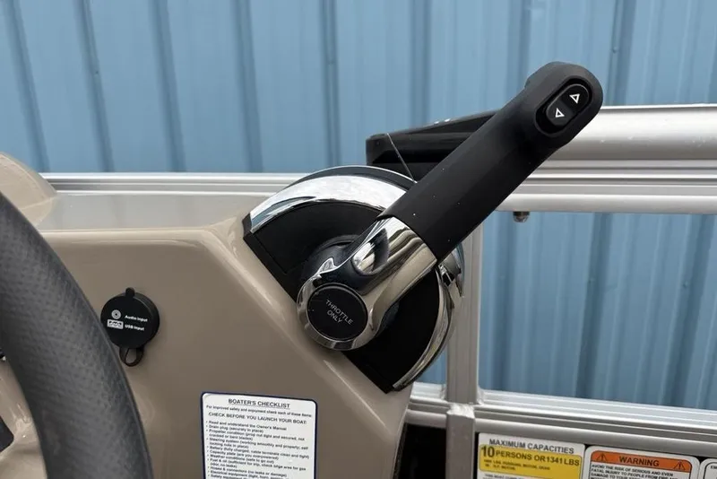 Slide: The Image of 2023 Sun Tracker SportFish 20 DLX throttle control and dashboard details. - 16