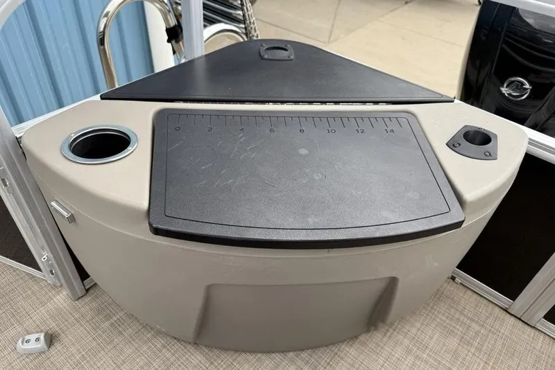 Slide: The Image of 2023 Sun Tracker SportFish 20 DLX fishing station with measuring board and cup holders. - 25