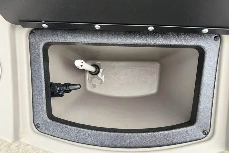 Slide: The Image of Storage compartment of 2023 Sun Tracker SportFish 20 DLX boat, featuring interior fittings. - 29