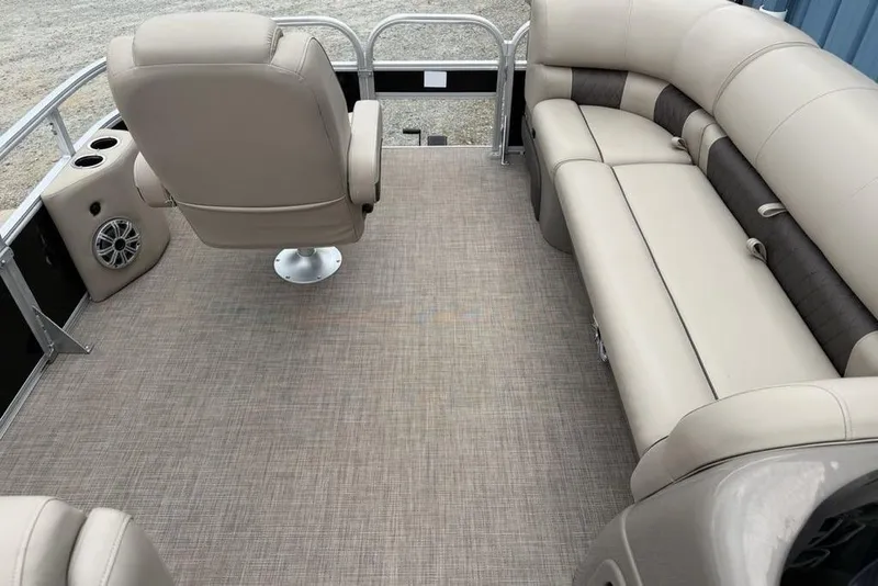 Slide: The Image of 2023 Sun Tracker SportFish 20 DLX interior with beige seating and carpeted floor. - 3