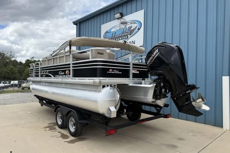 Slide: The Image of 2023 Sun Tracker SportFish 20 DLX pontoon boat with Mercury outboard motor on trailer. - 5