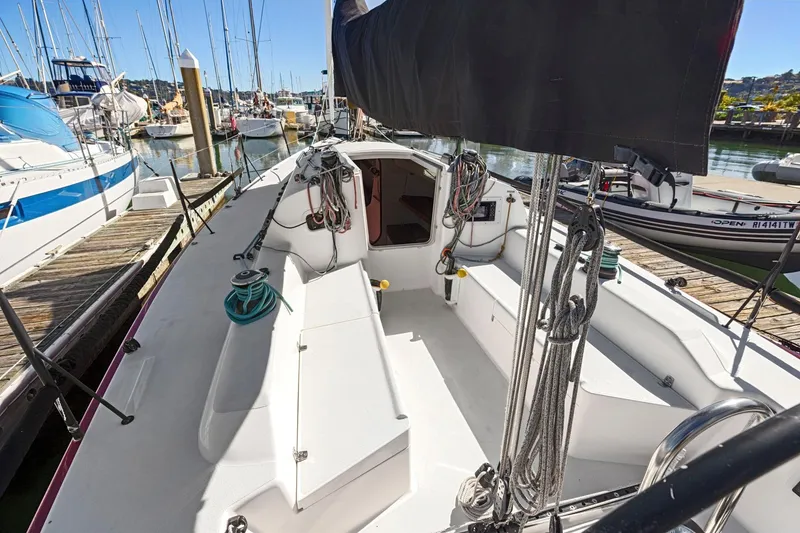 Slide: The Image of 2011 J Boats J 111 sailboat docked at marina, showcasing cockpit and rigging. - 11