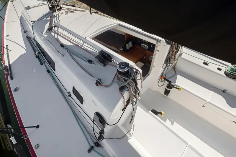 Slide: The Image of 2011 J Boats J 111 sailboat deck with rigging and open cabin view. - 12