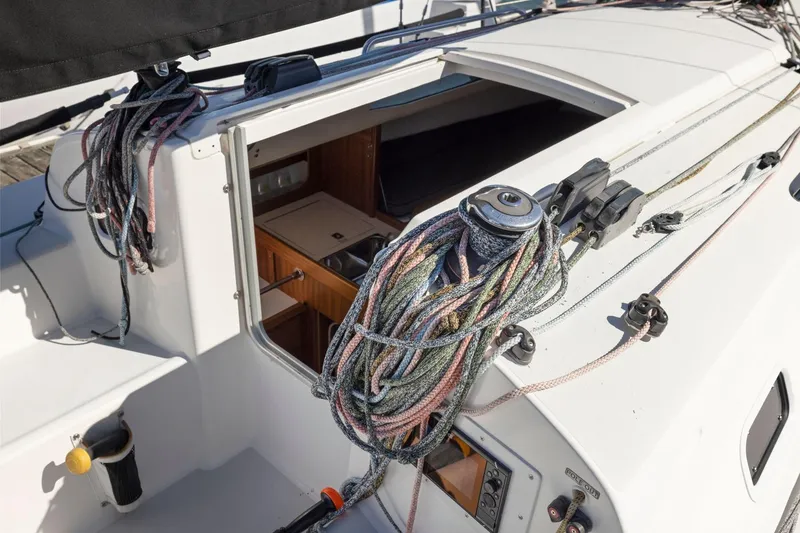 Slide: The Image of 2011 J Boats J 111 sailboat deck with ropes and cabin entrance. - 20