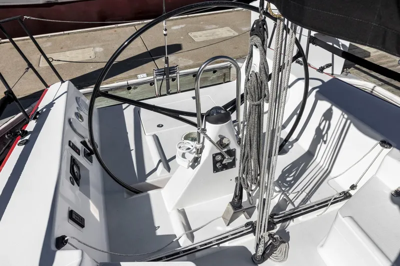 Slide: The Image of 2011 J Boats J 111 cockpit with steering wheel and rigging details. - 22
