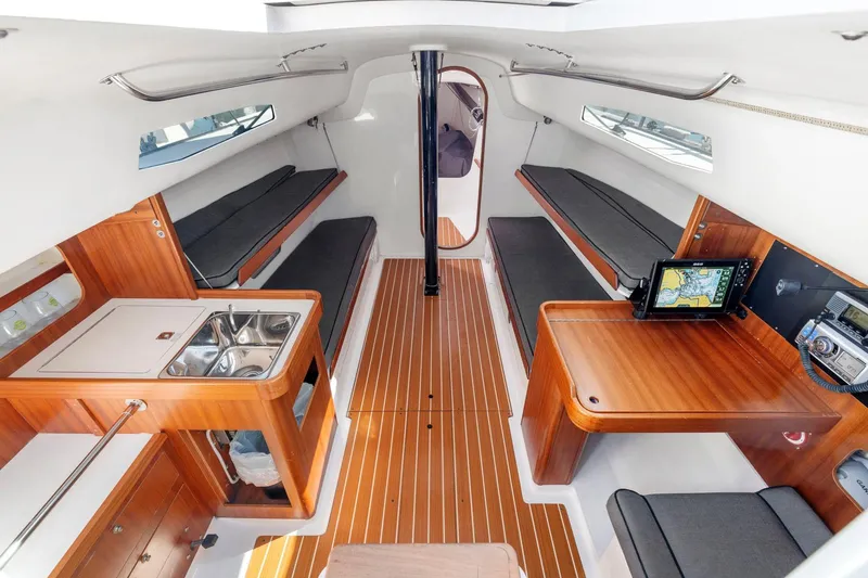 Slide: The Image of Interior of 2011 J Boats J 111 sailboat with wood finish and navigation equipment. - 24