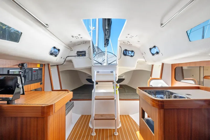 Slide: The Image of Interior of 2011 J Boats J 111 sailboat, featuring wood accents and modern amenities. - 25