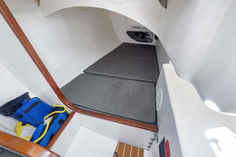 Slide: The Image of Interior cabin of 2011 J Boats J 111, featuring sleeping area and storage. - 28