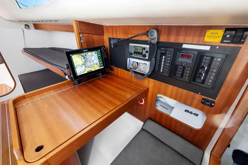 Slide: The Image of Interior of 2011 J Boats J 111, featuring navigation equipment and control panel. - 29