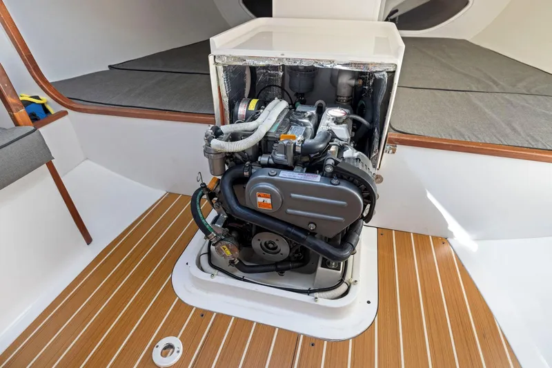 Slide: The Image of Engine compartment of a 2011 J Boats J 111 sailboat, featuring a compact marine engine. - 37