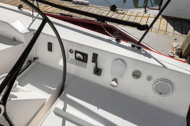 Slide: The Image of Cockpit of 2011 J Boats J 111 sailboat with steering wheel and control panel. - 8