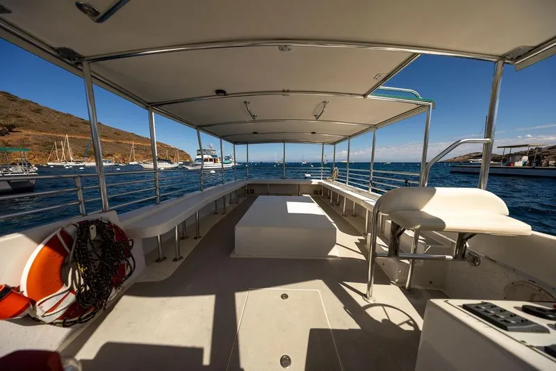Slide: The Image of Open deck of 2018 Seahawk Island Hopper boat with ocean view and seating. - 10